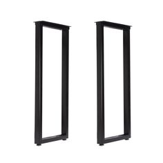 two tall black metal doors on a white background with no one in the photo looking at them