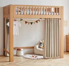 a child's bedroom with a bunk bed and curtains