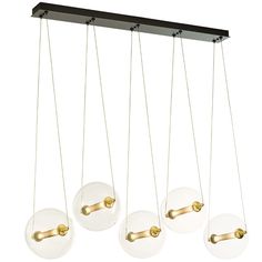 four lights hanging from the ceiling in different shapes and sizes