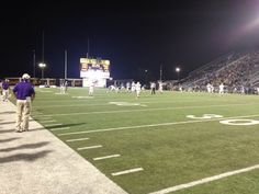 a football game is being played at night