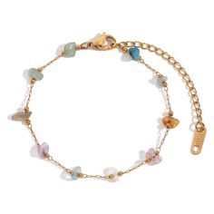 Unleash your inner boho with our Gemstone Beaded Gold Bracelet! Add some playfulness to your style with these unique pieces. Stack and collect different gemstones for a personalized look. (Pro tip: Mix and match for endless possibilities!) DETAILS & SIZE Finish: 18K gold plate Material: Stainless Steel, Amethyst, Faux Turquoise, Faux Pearls, Quartz Measurements: Beads: approx. 6mm; Chain: 6.5" + 2" extension Lobster Claw clasp Waterproof, tarnish-resistant, and nickel free Shop Bracelets for mor Dainty Adjustable Beaded Bracelets With Natural Stones, Different Gemstones, Waterproof Jewelry, Dainty Bracelets, Cartilage Piercing, Statement Bracelet, Cartilage Earrings, Single Earring, Summer Jewelry