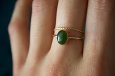 STUNNING 14k gold filled or Sterling Silver handmade Nephrite Jade ring set ✨ * Listing covers both the  Nephrite Jade ring and twisted band.  Beautiful 8x6mm natural oval olive green Jade gemstone✨⚒️  Jade is a special stone that is believed to promote wisdom, balance, and peace. Jade has a history that traces back to prehistoric times, to the ancient Chinese, the Maori, and to the Aztecs and Inca peoples of Central America.  Reputed by folklore to attract love, this stone was also believed to deliver prosperity and power to those who wore or carried it. * Please note photos are zoomed in up close, therefore the size of the stone may appear slightly larger in photos. Model is wearing a size US 5.5. Please refer to stone measurement to best determine the size & look you're looking for.  Ma Jade Ring Gold, Vintage Jade Ring, Jade Gold Ring, Jade Wedding Ring, Jade Rings For Women, Jade Engagement Ring, Jade Rings, Green Stone Ring, The Aztecs