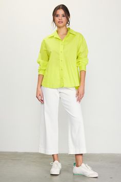 Crisp poplin lends an airy feel to this button-up shirt. Designed for a relaxed fit with a slightly open neckline, the long-sleeve style is a breeze to style with jeans, tailored pants, and skirts of all kinds. •Pointed collar •Relaxed neckline •Button front placket •Long sleeves •Button cuffs Item Number: 45737 100% POLYESTER Vacation Dresses Casual, Wedding Guest Dress Trends, Lime Yellow, Casual Wedding Dress, Fall Layers, Yellow Top, Vacation Dresses, Tailored Pants, Sweater Sale