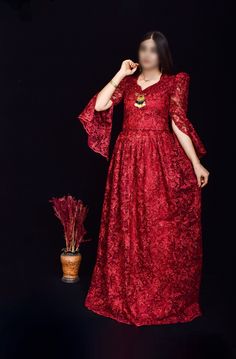 This stunning wine red Kurdish dress, featuring intricate floral embroidery and shimmering sequins, is the perfect choice for weddings, cultural events, and formal gatherings. The dress is designed with a flattering silhouette and detailed craftsmanship, showcasing the beauty of traditional Kurdish attire with a modern twist. The lace sleeves and delicate embellishments add an extra touch of elegance. *Material: Chiffon with sequins and floral embroidery *Size: Available in small size  *Care Ins Sequin V-neck Dress For Reception, V-neck Sequin Dress For Reception, Festive V-neck Wedding Dress, Festive V-neck Gown For Eid, Elegant Red Gown With Intricate Embroidery, Festive Embroidered Evening Dress For Reception, Embroidered Maxi Dress For Reception, Elegant Wedding Evening Dress With Zari Work, V-neck Embroidered Wedding Evening Dress