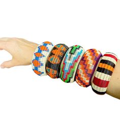 Our Werregue bracelets are handmade by Wounaan Indigenous women from fibers extracted from Werregue Palm Trees. Listing is for one colorful  bracelet with intricate woven pattern, These can be worn one at a time or together as a stackable set as is shown in the first picture. Care Instructions:  Do Not Wash. Rub them with a microfiber cloth. Our bracelets are made of Werregue palm fiber and dyed with leaves of plants , fruits  and flowers. MEASUREMENTS:  Due to its handmade nature, the size of the bracelets varies. PLEASE CHECK THE PICTURE WITH THE MEASUREMENTS OF THE DIAMETER OF EACH BRACELET  If you have any question don't hesitate in send me a message. Friendship Woven Bracelets, Artisan Multicolor Bracelets For Festival, Artisan Multicolor Bangle Bracelets, Artisan Multicolor Festival Bracelets, Multicolor Artisan Bracelets For Festival, Festival Beach Bracelets, Artisan Multicolor Beaded Bracelets Fair Trade, Artisan Bangle Bracelets For Friendship, Multicolor Artisan Beaded Bracelets Fair Trade