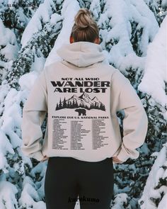 This Unisex hooded sweatshirt features "Not All Who Wander Are Lost | Explore Our U.S. National Parks | I Have Visited:" with a complete list of the 63 U.S. National Parks. You can actually bubble in the parks you have visited with fabric markers (white or black) and it's the perfect gift for adventurers! Make sure to check out the other garment options below :) » O P T I O N S « ‣ Tshirt: https://www.etsy.com/listing/1448546991 ‣ Crewneck: https://www.etsy.com/listing/896832864 » A B O U T « ‣ Fall Hooded Sweater With Letter Print, Outdoor Long Sleeve Sweatshirt With Letter Print, Long Sleeve Sweatshirt With Letter Print For Outdoor, Long Sleeve Letter Print Sweatshirt For Outdoor, Winter Outdoor Crew Neck Hoodie, Hooded Winter Hiking Tops, Winter Crew Neck Hoodie For Outdoor, Hooded Winter Tops For Hiking, Hooded Top For Winter Hiking