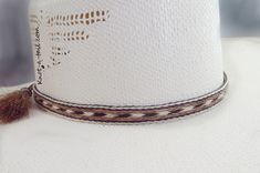 Cowboy hat band, genuine horsehair hat band, Five Strands wide ( 5/8 inch) BOLDLY done in a a natural brown-rich black and off-white Double horse hair tassels, Oh So Stetson perfect, **VERY Distinctive look **OUTSTANDING QUALITY ** STETSON perfect ** LUXURIOUS 100% genuine horsehair ** 5/8 inch wide. You will quickly discover that nothing compares to this extraordinary beauty: This horsehair hat band DEMANDS attention. This beauty is a 5 strands wide. Each strand is about 1/8 inch wide, separate Classic White Hat Bands For Rodeo, Classic White Hat Band For Rodeo, Elegant Brown Hat Band For Ranch, White Brimmed Hat Bands For Rodeo, White Southwestern Hat For Western-themed Events, Fitted White Hat Bands For Country Events, White Fitted Hat Bands For Country Events, White Southwestern Short Brim Hat, White Flat Crown Hat Bands For Beach