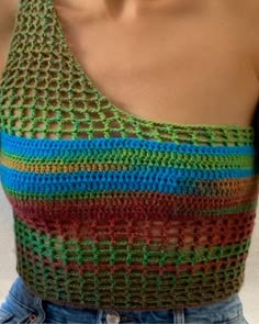 a close up of a person wearing a tank top with crochet on it