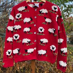 Vintage 90s Talbots Hand Knit Red Sheep Button Up Knit Knitted Cardigan Sweater. White And Black Sheep With Grass All Over Print. Hand Made. Iridescent Shell Like Buttons. One Of The Buttons Is Missing. There’s A Small Stain On One Of The Sheep. 45% Cotton, 43% Linen, 12% Ramie. Size Small. Measurements Armpit To Armpit: 20” Length: 21.5” No Trades Grunge Cottage Whimsical Whimsygoth Preppy Indie Streetwear Over The Garden Wall Sweater, Colorwork Knitting Patterns Sweaters, Japanese Fashion Winter, Winter Indie Outfits, Funky Sweaters, Cottage Whimsical, Sheep Cardigan, Sun Sweater, Knit Christmas Sweater