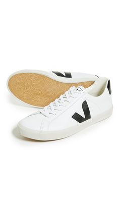 Leather: CowhideCushioned insoleContrast heel and logoLining is a blend of soft cotton and recycled plastic water bottlesSole made of Amazonian rubber, rice waste, and recycled rubberLace-up closureImported, BrazilThis item cannot be gift-boxedStyle #VEJAA30069These casual Veja sneakers are rendered in rich leather and accented with contrast branding at the sides. Veja Esplar, Plastic Water Bottles, Veja Sneakers, Recycled Rubber, Recycled Plastic, Leather Sneakers, Water Bottles, Brazil, White Black