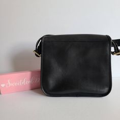 "Vtg Classic Coach NYC Stewardess Bag Navy leather (almost black) with brass hardware Roomy interior with inner zip pocket, outer full slip pocket and a small slip pocket Covered by a flap and secured with a turnlock Original hangtag and chain Adjustable 31\" strap at longest Measures: 11\"L, 11\"H, 3\"W Made in New York, USA #384-3612 Cleaned, conditioned and ready to wear! Questions? Just ask More vtg coach styles/colors also available G144" Black Flap Saddle Bag For Formal Occasions, Black Formal Flap Saddle Bag, Classic Black Flap Shoulder Bag, Classic Black Shoulder Bag, Classic Flap Bag With Brass Hardware For Work, Black Shoulder Bag With Coin Pocket, Black Shoulder Bag With Coin Pocket For Travel, Black Leather Shoulder Bag With Coin Pocket, Classic Flap Bag For Work