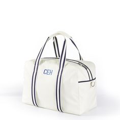 With a classic and sleek design, this bag is ready for more sports than a decathalon. Made from wipeable nylon with contrast piping, this flexible duffle has ample pockets and compartments for all your gym or sports essentials, including a shoe pocket to keep dirty shoes separate and a slip pocket for your water bottle. The striped straps are unstitched on one side, making the perfect slot for a rolled-up yoga mat or towel. Not just for the actively inclined, use it as a stylish overnighter for Sporty Rectangular Gym Bag With Luggage Sleeve, Sporty Rectangular Duffle Bag For Everyday Use, Sporty Everyday Rectangular Duffle Bag, Sporty Nylon Duffle Bag With Luggage Sleeve, Sporty Nylon Duffle Bag For Sports, Sporty White Duffle Bag For Travel, White Gym Bag With Zipper For Travel, Sporty Nylon Duffle Bag For Everyday Use, Sporty Gym Bags With Reinforced Handles