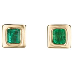 Elevate your style with our exquisite bezel-set emerald earrings, each showcasing mesmerizing Colombian emeralds with a medium vivid green hue and semi-transparent clarity. Crafted in luxurious 18k yellow gold and featuring an elegant latch-back closure, these earrings exude sophistication and timeless beauty, perfect for adding a touch of glamour to any ensemble. Setting Style: Bezel Setting Material: 18K Yellow Gold Main Stone: Emerald Count: 2 Shape: Emerald Cut Approx Weight: 1.85-Carats Clarity: Semi-Transparent Color: Green Luster: Good Treatments: Natural, Oiling Origin: Colombia Estimated Retail Value: $11,290.00 USD A certificate of appraisal is provided upon purchase. Emerald Cut Stud Earrings, Emerald Anniversary, Earring Video, Emerald Stud Earrings, Emerald Green Earrings, Statement Rings Diamond, Rose Gold Earrings Studs, Emerald Earrings Studs, White Gold Studs