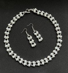 "White Glass Pearl Necklace Set   Pearl & Seed Bead Glass Set Necklace  & Matching Earrings Elegant Vintage Design     6mm white glass pearls     11/0 silver seed beads     Strung in flowing design     Necklace  measures 16\" in length     With Heart shaped T-bar     Earrings in a drop design     Silver  plated hooks   This design can be altered in length to suit needs Like it but in a different colour? Please just send me a message" White Metal Pearl Necklace With Round Beads, Elegant Beaded Earrings, White Pearl Necklace With Round Metal Beads, White Beaded Metal Pearl Necklace, Silver Beaded Necklaces With Pearl Drop For Party, Pearl White Beaded Metal Jewelry, Silver Beaded Necklace With Pearl Drop For Party, White Metal Jewelry With Silver Beads, Elegant Pearl Spacer Beads