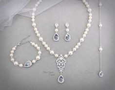 *Please order each item individually.* All my jewelry is nickel free - hypoallergenic. We use quality precious metal that are permanently bonded over the base metal, We are offers both Rhodium silver and Rose gold plated styles, including its popular line of personalized jewelry. Must be made to order with CRYSTALLIZED™ - Swarovski Elements. ~We provided 2 Color of Pearl for you to choose(Pic.10): ~Ivory Swarovski Pearl or White Swarovski Pearl Finish: Rose Gold plated or Rhodium silver plated components Material: Top quality rhinestones, Swarovski Xilion Bicone Bead, Swarovski Pearl, Best European Crystal, AAA Zircon, lobster clasp. Please choose the Teardrop color from the color chart（see pic.10） Color of Swarovski Crystal or Best European Crystal Teardrop Size of Teardrop: 19mm 1) Blue Crystal Jewelry Set With Pearl Drop As Gift, Elegant Hypoallergenic Crystal Jewelry, Nickel-free Cubic Zirconia Wedding Jewelry, Silver Teardrop Jewelry For Mother Of The Bride, Hypoallergenic Cubic Zirconia Wedding Jewelry, Hypoallergenic Crystal Jewelry For Anniversary, Blue Wedding Necklace, Sapphire Blue Wedding, Pearl Bridesmaid Earrings