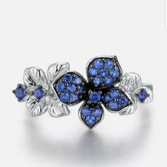 a ring with blue stones on it