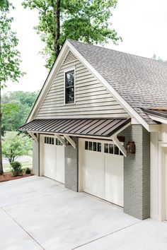 Sage green painted brick home with separate garage. Green Painted Brick, Garage Awning, Carport Modern, Door Overhang, House Awnings, Garage Pergola, Garage Door Design, Home Exterior Makeover