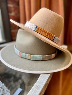 One of a kind hand woven hatbands in beautiful boho colors and patterns.  Hand woven by me on a wooden loom using luxurious fibers like linen, cotton, raw silk, bamboo and hand spun yarn. Perfect for that Fedora or summer straw hat . Price is per hat band. Standard fedora size (23 1/2 inches long) width is about 3/4 of an inch but can be woven to any size specifications. Always open to custom color & design ideas! You can shoot an email inquiring what is currently in stock, send me a screenshot Bohemian Braided Fedora Hat, Bohemian Braided Hat With Short Brim, Bohemian Braided Short Brim Hat, Bohemian Braided Fedora With Short Brim, Bohemian Braided Brimmed Hat, Bohemian Hats With Braided Flat Brim, Bohemian Flat Brim Braided Hat, Handmade Beige Bohemian Straw Hat, Bohemian Natural Hat Bands For Festival