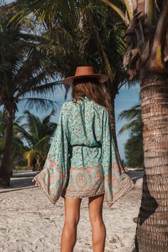 Product Details: Dreaming of the beach Open front Long sleeves Bohemian style Material: Cotton, Rayon Bohemian Flowy Long Sleeve Kimono, Casual Boho Print Festival Cover-up, Festival Boho Print Beachwear Cover-up, Bohemian V-neck Tropical Print Cover-up, Bohemian V-neck Cover-up With Tropical Print, Bohemian Green Tunic Kimono, Tropical Long Sleeve Cover-up For Beach Season, Beachy Boho Print Cover-up For Vacation, Long Sleeve Boho Dress For Beach