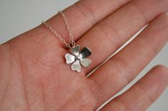 Each flower is handmade from sterling silver. The flower hangs along an 18" sterling silver chain.Available in-METAL- Sterling SilverFINISH- Brushed/SmoothSIZE- 1/2"Comes Gift Wrapped!++++++++++++++++++++++++++++++++++++++++++++++++++++++++++++++++MADE TO ORDERPlease see FAQ for current processing time and Return Policy before ordering.*PLEASE READ BEOFRE ORDERING*All of the metals (Sterling Silver, Copper, Brass) used in my jewelry are left natural; I do not use sealers or plate them. These met Handmade Sterling Silver Petal Jewelry, Delicate Sterling Silver Petal Jewelry, Minimalist Sterling Silver Flower Necklace, Silver Delicate Flower Charm Necklace, Delicate Silver Flower Charm Necklace, Handmade Dainty Sterling Silver Flower Necklace, Handmade Silver Flower Necklace, Nickel Free Sterling Silver Flower Necklace, Delicate Sterling Silver Birth Flower Necklace