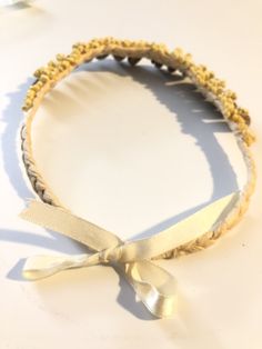 "Shell Choker. Strung from dried, braided palm leaves are olive shells embellished by tiny delicate shells. Very regal jewel from the sea. 16\". Ribbon closure." Shell Choker, Palm Leaves, Beaded Necklaces, Live Lokai Bracelet, Choker, The Sea, Shells, Beaded Necklace, Braids