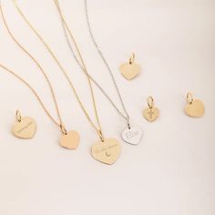 "14K 18K Solid Custom Engraved Heart Necklace, Personalized Dainty Gold Pendant, 2 Side Personalized Date Name Heart Pendant Gift for Her/Him ► Adding a customized tiny bar at clasp may be a good idea: https://etsy.me/3cn9OQ5 Material: Solid Gold (real gold, no gold-filled or no gold plated material) Karat: 14K (585), 18K (750) Available Gold Colors: Yellow, rose and white Available chain thickness: 0.84mm, 0.95mm Available Heart pendant size (width): 10mm, 12mm, 14mm The pendant can be engraved  2 sided upon request.  You can customize the chain length from 14\" to 20\". The \"cable chain\" is used for this necklace. You can write for longer and different chain options. Chain Length - 14 inches (choker) Chain Length - 16 inches adjustable 15 inches (choker) Chain Length - 18 inches adjust Engraved Rose Gold Heart Pendant Charm Necklace, Gold Heart Sterling Silver Charms, 14k Gold Engraved Double Heart Jewelry, Elegant Engraved Heart Pendant Charms, Engraved 14k Gold Double Heart Jewelry, Engraved Double Heart Yellow Gold Jewelry, 14k Gold Heart Engraved Charm Necklace, 14k Gold Heart Charm Necklace Engraved, 14k Gold Heart-shaped Engraved Charm Necklace