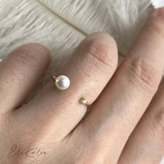 One piece of unique natural diamond and Akoya pearl open ring, a modern Toi Et Moi engagement ring * Metal: 18K solid gold * Stone: 4-4.5mm genuine Akoya pearl and earth mined diamond, G-H color/SI clarity * Carat: 0.02ctw * Stamp: 18K * Guaranteed Authentic Solid Gold, Not Plated or Filled ❤️Follow us on Instagram @ elekalonjewelry for latest projects and designs. *If you have any questions, please feel free to message us. Pearl Open Ring For Wedding, Open Pearl Ring For Wedding, Minimalist Open Pearl Ring With Diamonds, Wedding Pearl Open Ring, White Pearl And Diamond Open Ring, Pearl White Open Ring For Anniversary, White Gold Pearl Open Ring, Minimalist Diamond Pearl Ring As Gift, Anniversary Pearl White Open Ring Pearl Ring