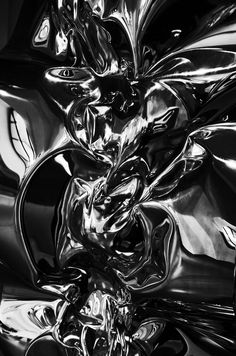 black and white photograph of shiny metal material