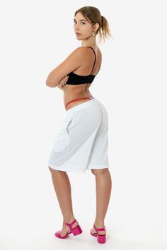 These long basketball-style shorts are made of a durable polyester mesh that lets just enough light through to give a sexy edge to this masculine garment. These shorts are very oversized, and we recommend women wear them low waisted with your favorite crop top. Features 2 side pockets and an adjustable drawcord waist. This garment is unisex, and women may want to take one size smaller than their usual size. Made in Los Angeles, Calif. Our experienced seamstresses earn an average up to $20 an hou White Nylon Athletic Shorts With Built-in Shorts, Athleisure Mesh Shorts With Elastic Waistband, Nylon Shorts With Mesh Pockets, Summer Nylon Shorts With Mesh Pockets, Mesh Workout Shorts With Elastic Waistband, Nylon Athletic Shorts With Mesh Pockets For Summer, Summer Sports Shorts With Mesh Pockets, Summer Athletic Shorts With Mesh Pockets, Athleisure Athletic Shorts With Mesh Pockets