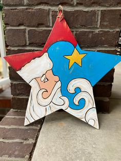 a painted star on the side of a brick wall with a cartoon character in it