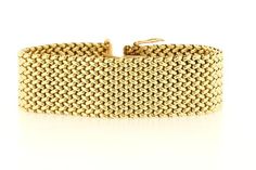 This chic woven linked bracelet is made in rich 14K Yellow gold. The piece is secured to the wrist via a box clasp and latch system. The bracelet measures 23mm wide, sits 2.48mm tall, and is of 7 inches in length.  B1848BIVPPD --Please reference our policy for more details before purchase--***For International orders, please provide a phone number for shipping purposes. Just place a note in the comment box during check out.Thank you.** Luxury Yellow Gold Chain Bracelet With Clasp, Elegant Gold Link Bracelet With Clasp, Luxury Chain Bracelet With Clasp For Formal Occasions, Luxury Chain Bracelet With Clasp For Formal Events, Elegant Gold Link Bracelet, Luxury Gold Chain Bracelet With Clasp, Luxury Link Chain Bracelet With Box Clasp, Elegant Link Bracelets With Clasp, Luxury Yellow Gold Bracelets With Clasp