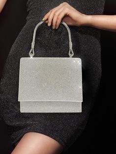 BagForLove - Party-ready Mini Square Bag with Glitter Flap and Rhinestone Detail Product Description Color Silver Details Rhinestone Magnetic Yes Strap Type Top Handle Bag Size Mini Pattern Type Plain Type Square Bag Closure Type Flap Material Glitter Composition 100% Polyester Size Chart INCH CM Bag Height Bag Length Bag Width Handle Height Strap Length 5.5 inch 6.3 inch 2.8 inch 4.3 inch 47.2 inch Bag Height Bag Length Bag Width Handle Height Strap Length 14 cm 16 cm 7 cm 11 cm 120 cm Details Pictures Similar Products h2 { text-align: center; } /* æ¢è¡ */ li{ white-space: normal; word-break: break-all; word-wrap: break-word; } .red-box { width: 100%; display: flex; flex-direction: row; flex-wrap: wrap; justify-content: center; } .red-box > div { width: 190px; height: 250px; margin: 10p Glamorous Bling Evening Bag For Party, Sparkling Crystal Bags For Party, Rhinestone Handheld Evening Bag For Party, Handheld Rhinestone Evening Bag For Party, Crystal Evening Bag With Bling For Party, Crystal Bling Evening Bag For Party, Rhinestone Top Handle Evening Bag, Crystal Evening Bag With Rhinestones For Parties, Party Shoulder Bag With Rhinestones And Crystal Material