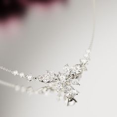 Introducing Blossom: Crafted as a romantic high-end floral necklace to complement any of our other pieces as a set or to shine brightly on it's own. This classical necklace is perfect for any occassion. As a gift for her, a supplement to an engagement ring or a gift for yourself - because you deserve it - it is guaranteed to impress. A bright and shiny string of simulated diamonds make this necklace stand out and is sure to bring lots of compliments. Each stone shines brightly to perfection and Silver Flower-shaped Necklace For Parties, Silver Flower Shaped Necklace For Party, Silver Cubic Zirconia Bridal Necklace Gift, Silver Necklace With Flower Shape For Party, Delicate Formal Necklaces For Mother's Day, Exquisite Wedding Necklace With Clavicle Chain, Delicate Sterling Silver Jewelry With Elegant Design, Elegant Flower-shaped Sterling Silver Jewelry, Dazzling Sterling Silver Necklace With Elegant Design