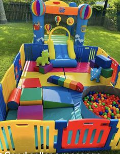 an inflatable play area with balls and toys