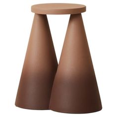 two brown vases sitting on top of each other