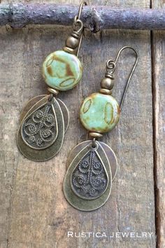 Boho brass and earthy green Czech glass dangle earrings. Earthy Bronze Earrings With Ear Wire, Earthy Brass Jewelry With Ear Wire, Green Brass Earrings Nature-inspired, Vintage Green Patina Earrings, Earthy Green Dangle Earrings, Green Brass Earrings With Wire Wrapping, Green Patina Bohemian Earrings, Green Bohemian Earrings With Patina, Green Bohemian Patina Earrings