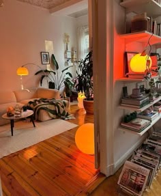 a living room filled with furniture and lots of books