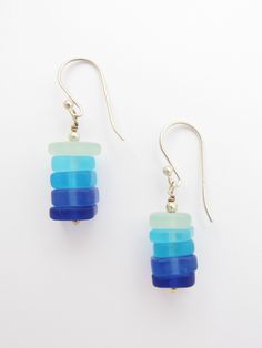 These earrings are made with stacked graduating blue color glass. Each handmade earrings is 1 3/8 inch in length, including the ear wire. All Sterling Silver is components, wire, round beads, headpin and earwires. The pendants are made with recycled glass and put through a man-made process that simulates the effect of many years of erosion by Mother Nature and the Sea. More earrings: https://www.etsy.com/listing/203878280/handmade-cultured-sea-glass-earrings?ref=shop_home_active_1&frs=1 Also Blue Wire-wrapped Glass Earrings, Blue Glass Wire Wrapped Earrings, Blue Wire Wrapped Glass Earrings, Nickel-free Blue Recycled Glass Earrings, Blue Recycled Glass Nickel-free Earrings, Blue Nickel-free Recycled Glass Earrings, Adjustable Blue Jewelry Made Of Recycled Glass, Adjustable Blue Jewelry With Recycled Glass, Adjustable Blue Recycled Glass Jewelry