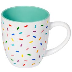 a coffee cup with sprinkles painted on it