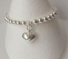 Sterling Silver Heart Charm Bracelet -  Handmade bracelet made with 5mm 925 Sterling Silver highly polished beads, beaded onto premium quality beading wire, this wire is extremely strong and also very flexible, giving a nice drape to the bracelet.  I attached the highly polished puffy Sterling Silver 12mm x 12mm heart charm and finished with a Sterling Silver clasp to secure. These bracelets look great when worn on their own or layered / stacked with other bracelets and bangles. Please select yo Beaded Ball, Turquoise Bead Bracelet, Ball Bracelet, Beading Wire, Bead Charm Bracelet, Gorgeous Bracelet, 925 Silver Jewelry, Handmade Bracelet, Bracelet Handmade