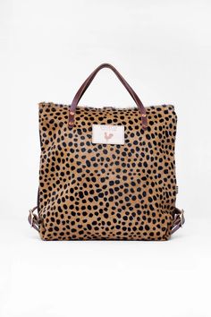 Cheetah Hair on Hide Leather Backpack | Leather Pocketbooks | Meanwhile Cheetah Print Hair, Cheetah Hair, Rooster Logo, Lynchburg Virginia, Cheetah Pattern, Pattern Hair, English Bridle, Teacher Bags, Back To School Backpacks