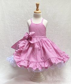 "Pink Gingham babygirl tulle dress Welcome to my shop.  Get ready to make a statement with this adorable Pink Gingham babygirl dress. This fun, pretty pink gingham ruffle dress is the perfect dress for your little one's birthday party, Halloween costume, pageant dress, or any special occasion.  This lovely dress is handmade from start to finish, by me in my studio.  There is no doubt your little one will be so excited to wear this pink gingham barbie costume.  *The bodice and skirt are fully lin Gingham Barbie, Pink Birthday Dress, Baby Tulle Dress, Pageant Costumes, Birthday Party Halloween, First Birthday Dress, First Birthday Dresses, Barbie Costume, Wonder Woman Costume