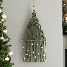 a christmas tree hanging from the side of a wall