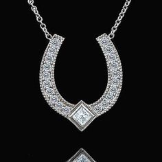 Diamond Horseshoe Necklace Lucky Pendant Good Luck Symbol Lucky Charm Gold Princess Horseshoe is widely known symbol of good luck. Designer diamond horseshoe is made of 14k white gold and is 16mm tall (6/10inch) 13mm (5/10inch) wide. Pendant comes with 14K white gold chain (16 or 18 inch length, weights approx 1.1g), weights 1.4g (without chain). Necklace contains round cut diamonds and one princess cut diamond .24cttw, SI1 - SI2 clarity, G-H color. This gold pendant was designed and created by Luxury Horseshoe-shaped Formal Jewelry, Luxury Horseshoe Jewelry For Formal Occasions, Classic Horseshoe Jewelry With Diamond Accents, Classic Horseshoe Diamond Accents Jewelry, Formal Horseshoe Jewelry With Diamond Accents, Elegant Sterling Silver Horseshoe Jewelry, Formal Horseshoe Diamond Jewelry, Classic Horseshoe Jewelry, Elegant Horseshoe Jewelry For Anniversary