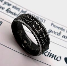 Keep your favorite words of inspiration close to your heart or share it with someone you love. This unique Custom Engraved Tungsten Wedding Ring features the Bible Verse Ephesians 5:25 which says - Husband , love your wives, just as Christ loved the church and gave himself up for her. On the other side of the ring we have engraved Proverb 18:22 - He who finds a wife finds what is good and receives favor from the LORD. You can order the ring as is, but there is an option to select a custom engrav He Who Finds A Wife, Bible Verse Ephesians, Mens Promise Ring, Christian Ring, Words Of Inspiration, Handwritten Text, Promise Rings For Guys, Love Your Wife, Tungsten Wedding Rings