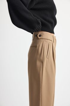 Discover the ultimate in comfort and style with our Adjustable Waist Trousers. Designed to offer a customizable fit, these trousers feature adjustable side buttons and side pockets. Pair it with our Oversized Double Button Blazer for an effortless look. Runs small, size up. Classic Cargo Pants With Welt Pockets For Fall, Classic High-waisted Cargo Pants For Work, Classic High-waisted Cargo Pants With Welt Pockets, Classic Straight Leg Cargo Pants For Fall, Fitted High-waisted Cargo Pants With Button Closure, Classic Wide Leg Cargo Pants For Work, Classic Wide-leg Pants With Side Pockets, Classic Fall Chinos With Side Pockets, Wide-leg Pants With Side Pockets For Work