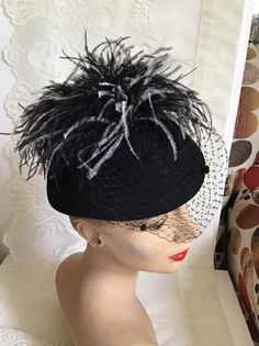 "Vintage 1970's dark Black Wool Felt hat. Has veiling with Black and White feathers. Label is *Miss Bierner*. Made in USA. *MORE INFORMATION BELOW* CONDITION: No issues noted. MEASURES: Inside circumference~21\" Front to back~7\" Left to right~8\" *WE APOLOGIZE~BUT WE NO LONGER SHIP TO GERMANY, ITALY OR SPAIN. IF ORDERS COME IN FROM GERMANY, ITALY OR SPAIN, WE WILL HAVE TO CANCEL THEM AND REFUND YOUR MONEY. SORRY FOR THIS INCONVENIENCE*" Vintage Black Wide Brim Costume Hat, Vintage Black Cloche Hat For Evening, Black Brimmed Hat For Vintage Events, Vintage Black Top Hat For Church, Vintage Black Hat For Evening, Vintage Black Cloche Hat With Wide Brim, Black Vintage Cloche Hat With Wide Brim, Black Vintage Cloche Hat, Vintage Black Cloche Hat