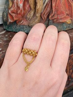 Beautiful solid yellow gold ring, hallmarked with unidentified figures and the French owl. After some research this ring appears to be a traditional Sardinian engagement/ wedding ring. The honeycomb spheres covering the ring symbolize wheat grain, representing prosperity and love. Our version is unusual as it also features a sturdy chain, from which dangles a sweet heart padlock and key. This style of ring has variations found in many parts of Europe including Portugal, England (cannetille filig Antique 22k Gold Wedding Ring, Antique 22k Gold Ceremonial Rings, Antique 22k Gold Rings For Ceremonial Occasions, 22k Gold Antique Rings For Ceremonial Occasions, Traditional 14k Gold Filigree Rings, Antique 22k Gold Jewelry For Anniversary, Vintage 22k Gold Wedding Rings, Victorian 14k Yellow Gold Cluster Ring, Vintage Ceremonial Open Ring