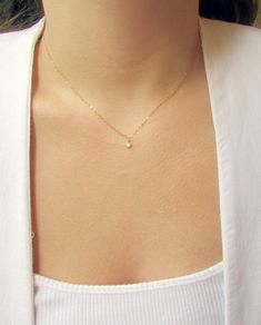 The Tiny CZ Gold Necklace is so petite and feminine! The sparkling cubic zirconia charm hangs from a 14K gold or rose fold filled chain. This is the perfect gift for a friend, or treat yourself! ---------------------- FEATURES ◊ Tiny Cubic Zirconia charm (4mm x 7mm) ◊ 14K gold filled or rose gold filled chain ◊ All necklace findings (clasp, jump rings, tag) & chain are 14K gold filled to ensure the highest quality piece ---------------------- PACKAGING ◊ We do the gift-wrapping for you! All Dainty Rose Necklace, Dainty Rose Gold Necklace, Choker Gold Necklace, Rose Gold Choker, Gold Necklace Dainty, Dainty Gold Chain, Dainty Necklaces, Choker Gold, Gold Necklace Simple