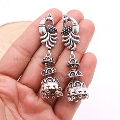 Peacock Silver Dangle Earring, Jhumka Silver Earring, Oxidized Dangle Drop Earring, 925 Sterling Silver Earring, Cyber Monday Sale ✦ ✦ METAL DETAILS✦ ✦  ✦ Metal : 925 Sterling Silver ✦ Earring Size : 68X15 mm  ✦ Total Weight : 28.52 Gram  ✦ Earring Box : Yes ✦ CUSTOMISATION DETAILS✦ We can customize any piece of fine jewelry. You can simply message us on Etsy or drop a text at +91-7357229656 (WhatsApp/I Message) to let us know about all the customization you want. Customization can include : ✦ Metal Type: 9K Gold, 10K Gold, 14K Gold, 18K Gold, 22K Gold, 925 Sterling Silver (All designs) ✦ Any Other Request: Your dream it appears can make it! Let us know about any request you have and we will get it done for you! ✦ Have your own custom design? Send us a message and we will make it for you e Silver Dangle Temple Jewelry Earrings, Sterling Silver Round Peacock Design Jewelry, Sterling Silver Peacock Design Jewelry, Peacock Design Dangle Earrings For Gift, Gift Peacock Design Dangle Earrings, Sterling Silver Jewelry With Peacock Design, Silver Round Earrings With Peacock Design, Silver Earrings With Peacock Design As A Gift, Silver Dangle Jewelry With Peacock Design